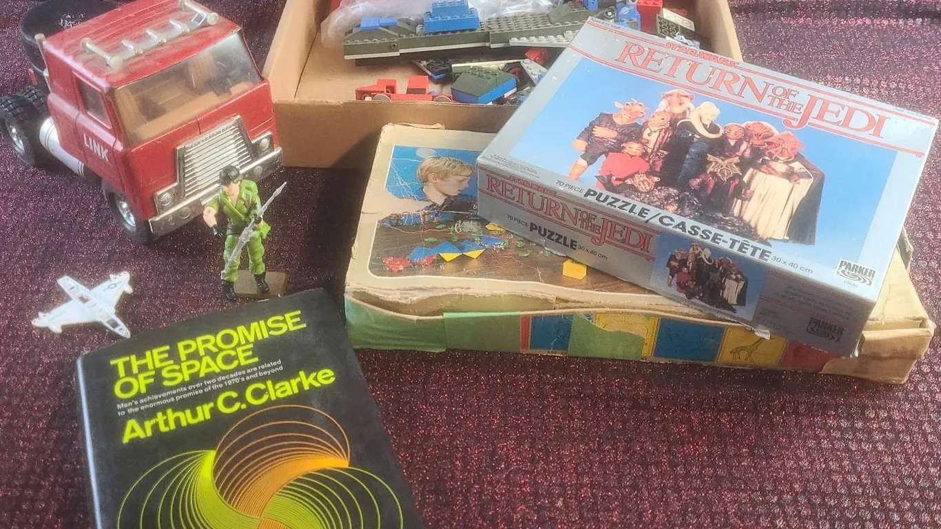 Toys and Collectibles Including Star Wars Puzzle, Ertl Truck, Lesney Plane, and Space Book