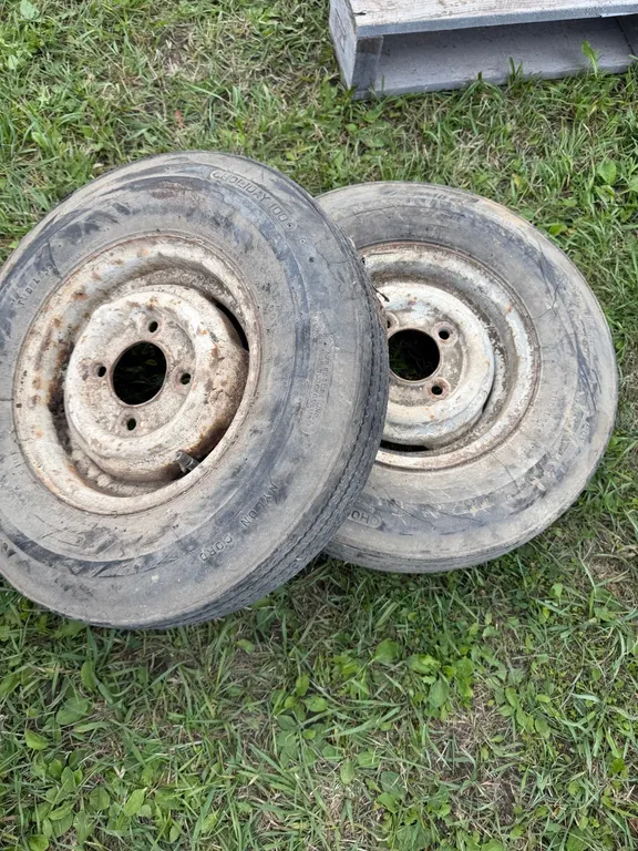 2 trailer tires and rims (GST 5 % charged)