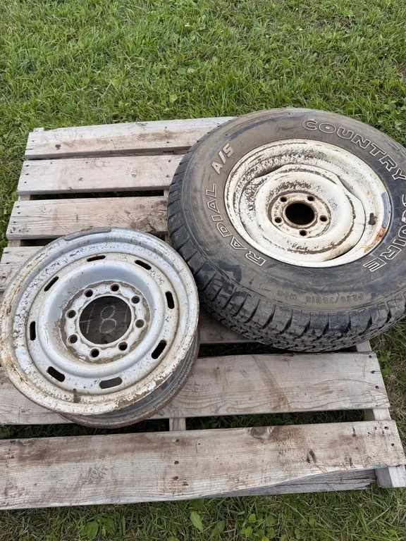 Like new spare 235/75 R15 tire and rim. (GST 5 % charged)