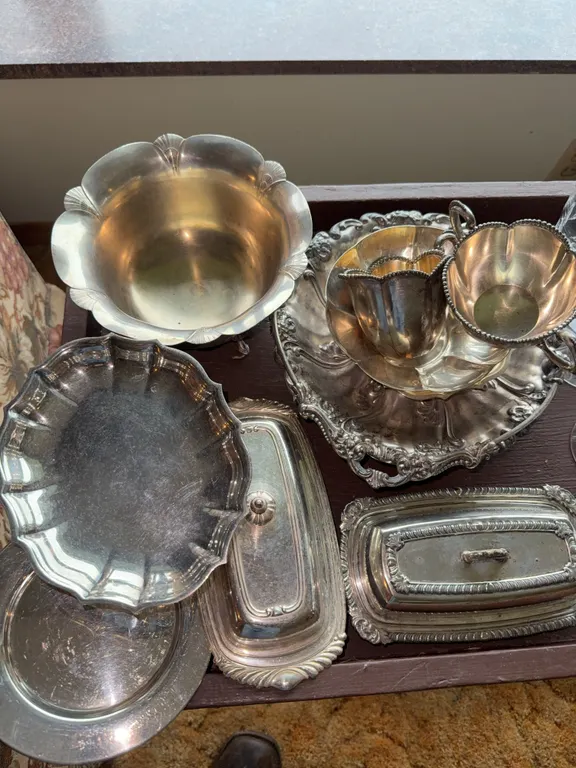 Silver bowls and butter dishes