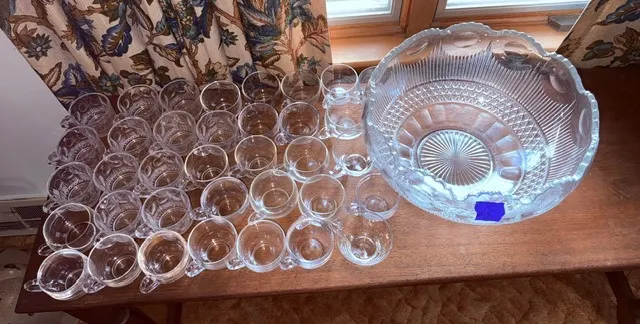 Glass punch bowl with serving ladle, and glass cups
