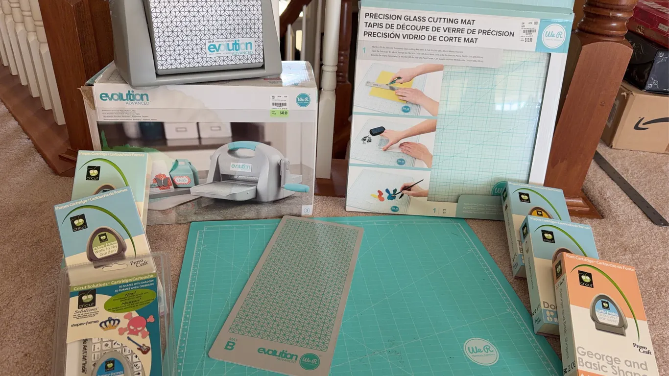 We R Memory Keepers Evolution Advanced Machine with Cricut Cartridges & Precision Cutting Mat Lot
