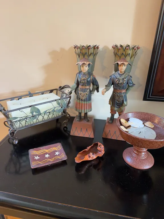 Carved Figural Pair with Mixed Decorative Tabletop Accents