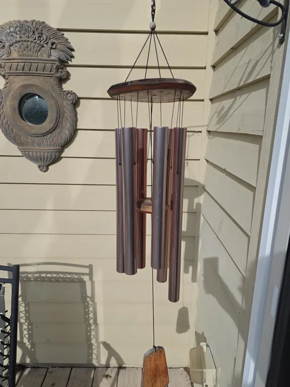 Wind Chime and Ornate Cast Metal Wall Mirror