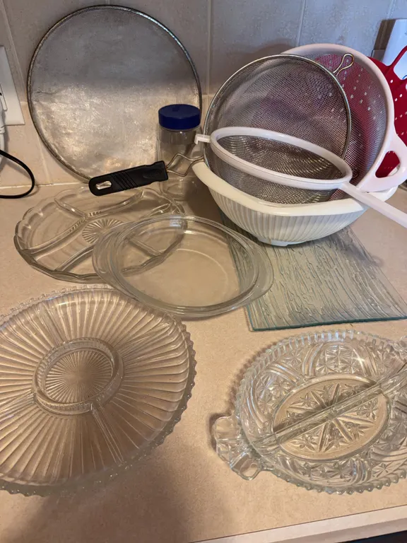 Kitchen Lot: Pressed Glass Trays, Strainers, and Colander