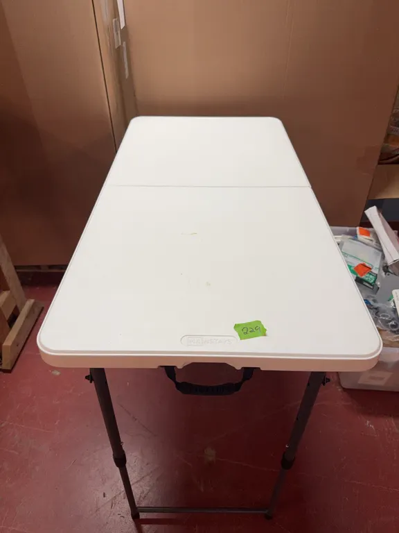 Plastic folding table