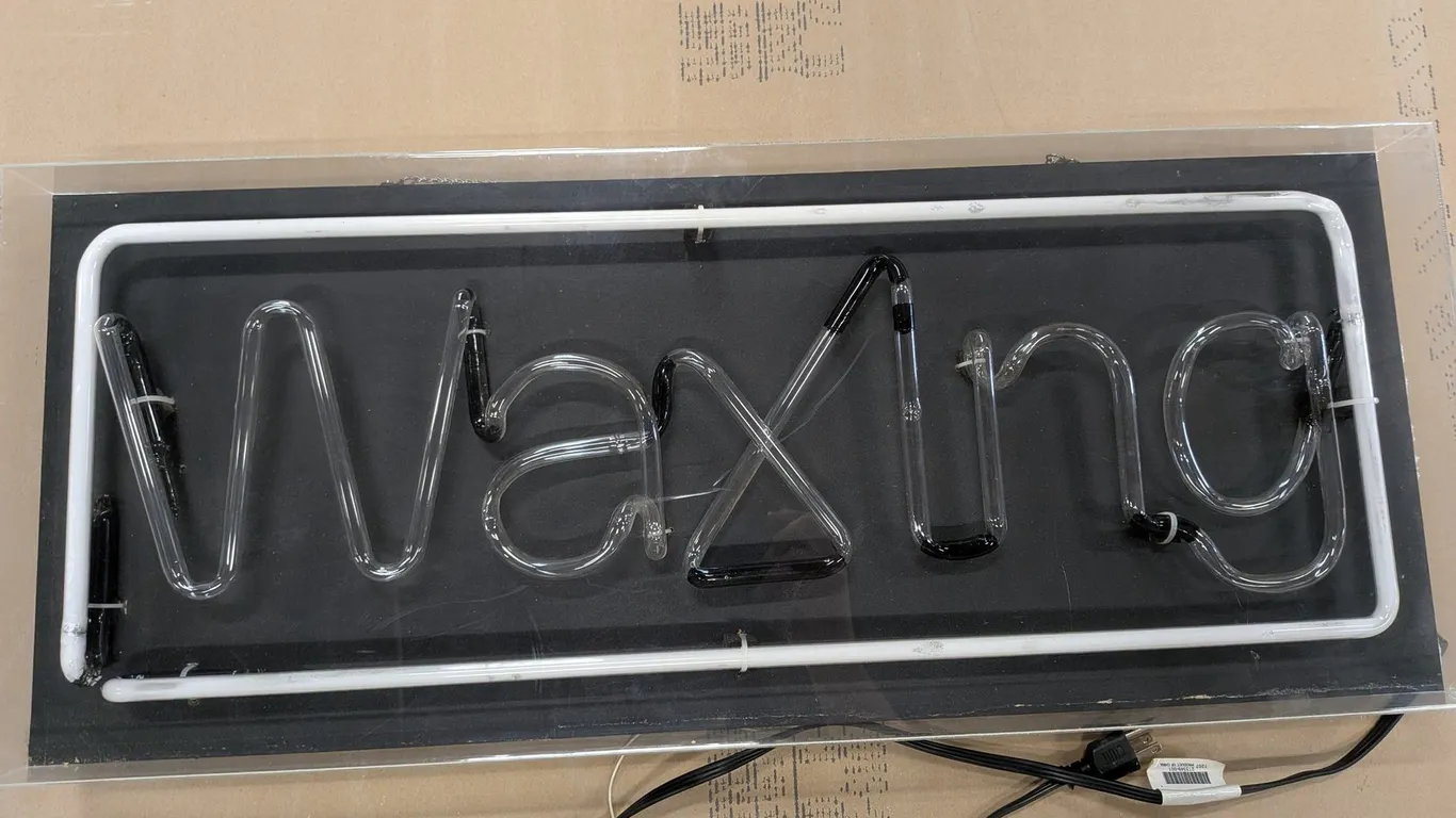 Neon "Waxing" Sign