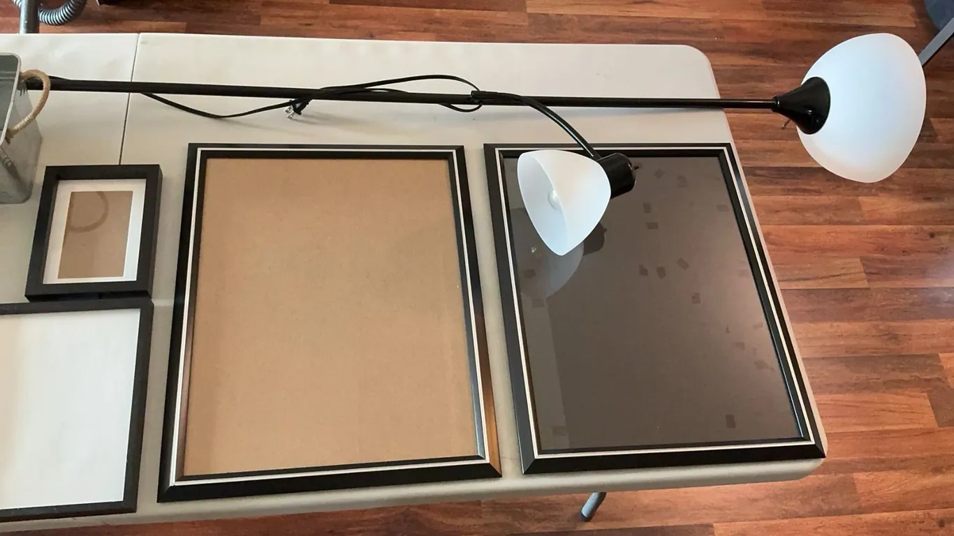 Empty Picture Frames, Two-Light Floor Lamp, Large Planter, Metal Container
