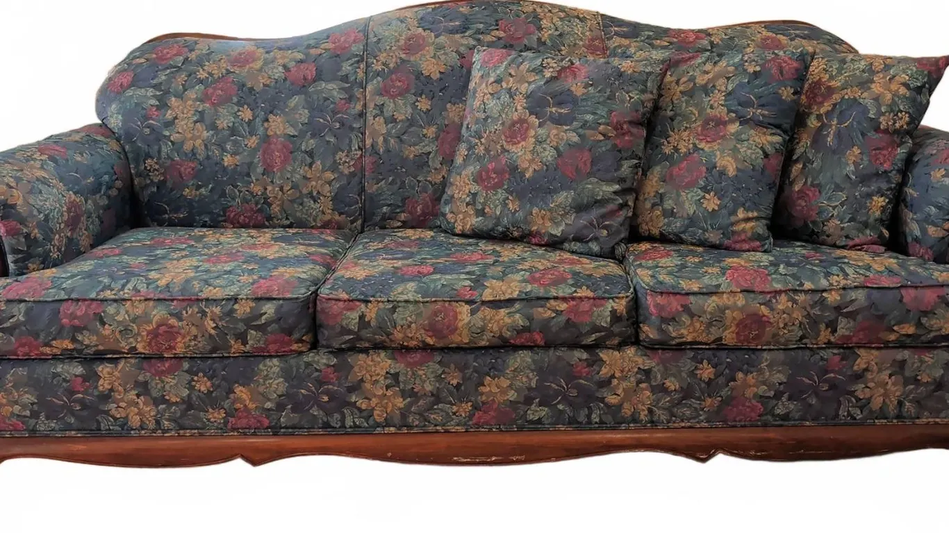 Floral Upholstered Sofa with Carved Wood Frame and Three Throw Pillows