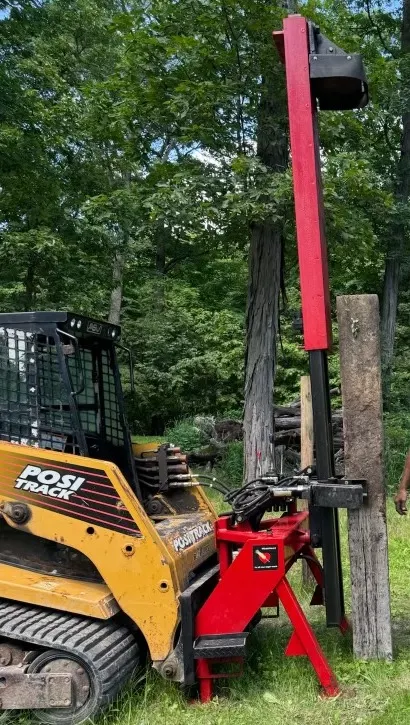 Wheatheart Manufacturing Skid Steer Mounted Post Pounder - Self Contained system. Attachments for Round post and railroad ties
