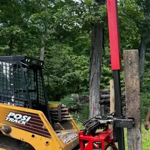 Wheatheart Manufacturing Skid Steer Mounted Post Pounder - Self Contained system. Attachments for Round post and railroad ties