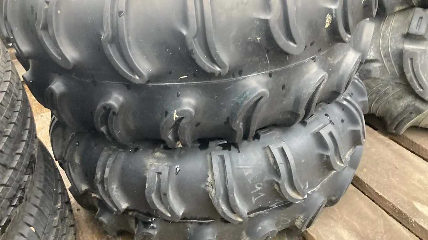 (1) Super Swamper 25x9.50-10 and (1)Super Swamper 25x9.50-11 with 4 Bolt Rim