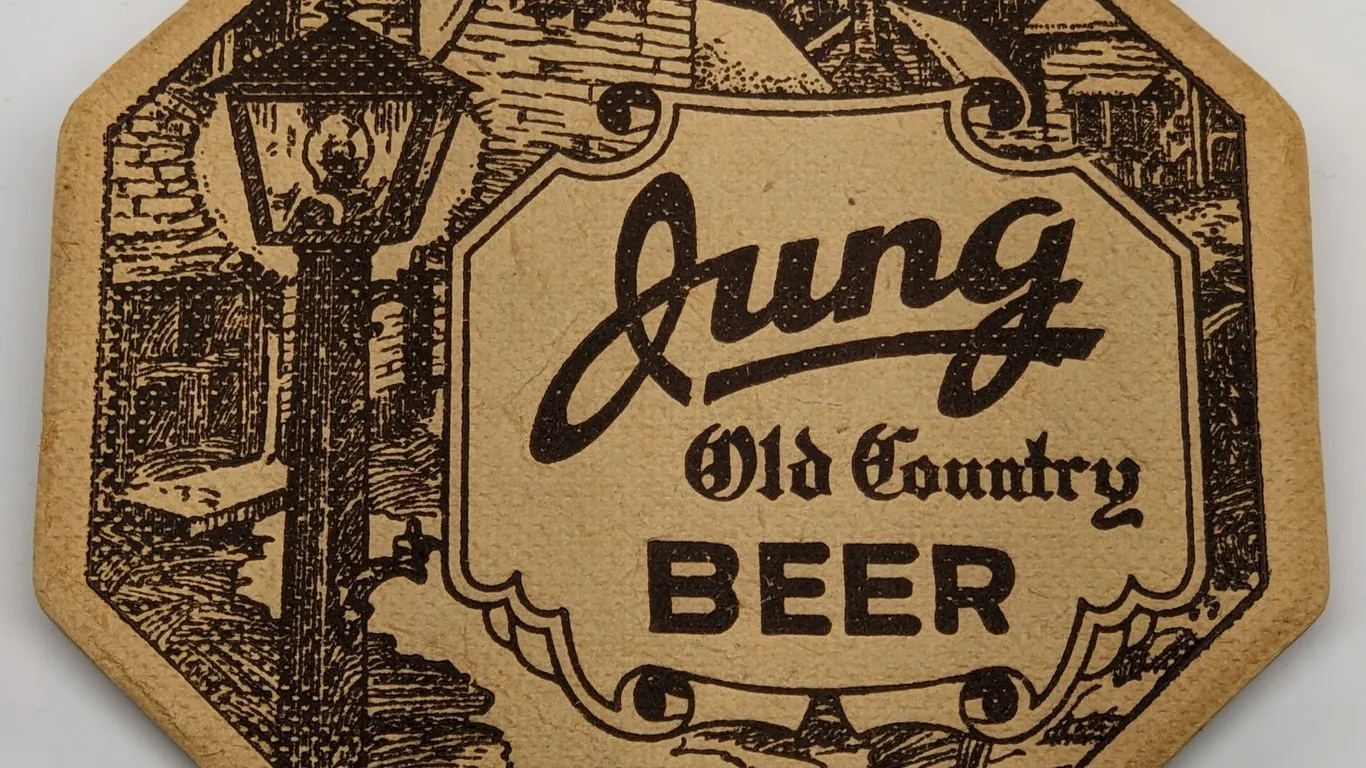 JUNG OLD COUNTRY BEER COASTER RANDOM LAKE WISCONSIN (ABSORBO)
