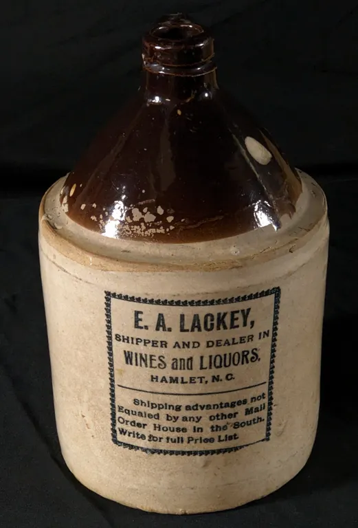 1 GAL STONEWARE ADVERTISING CROCK JUG E.A. LACKEY SHIPPER & DEALER IN WINES & LIQUORS HAMLET NORTH CAROLINA NC
