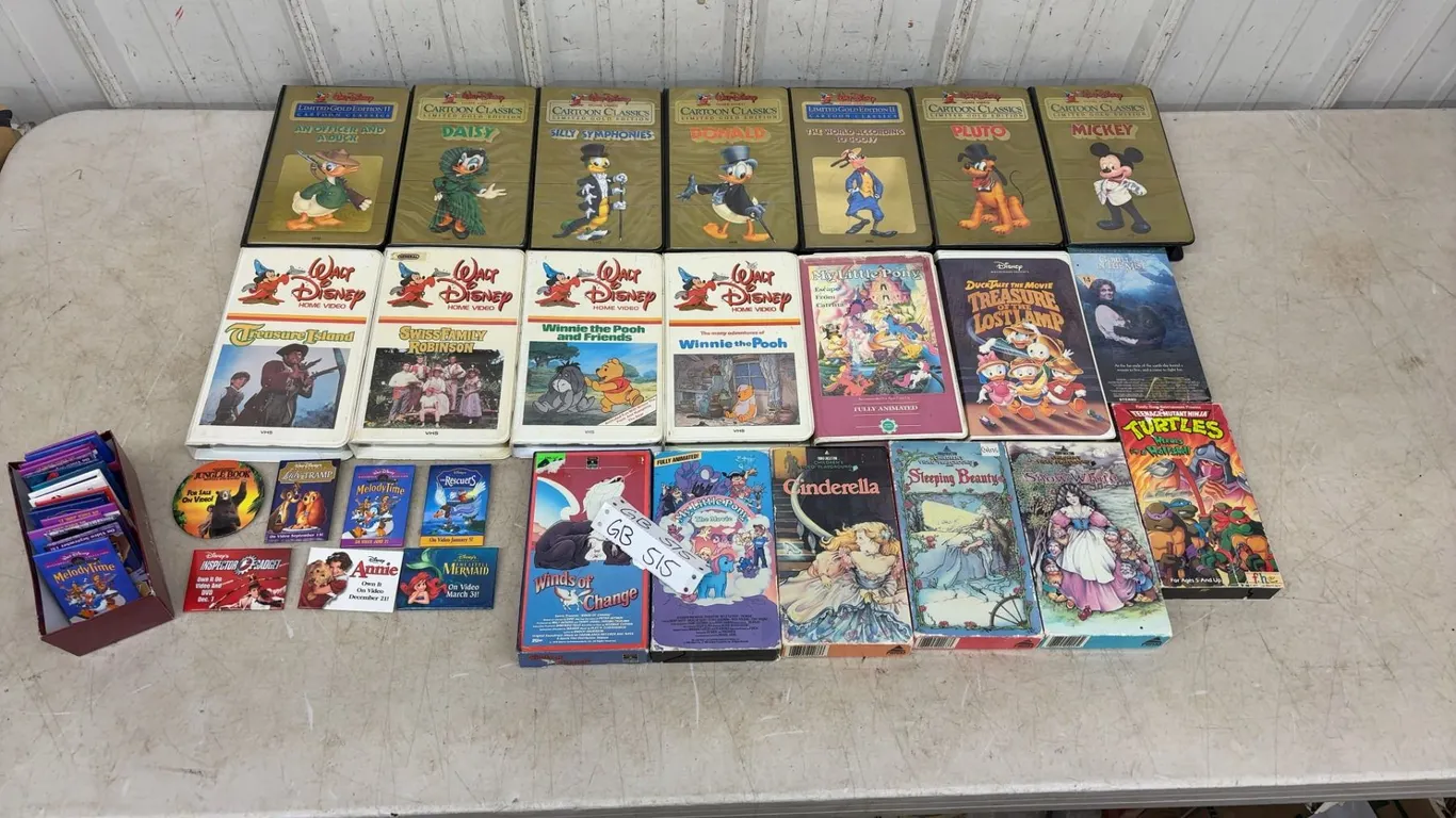 20 Children’s VHS Movies most classic Walt Disney and 22 W.D. pins