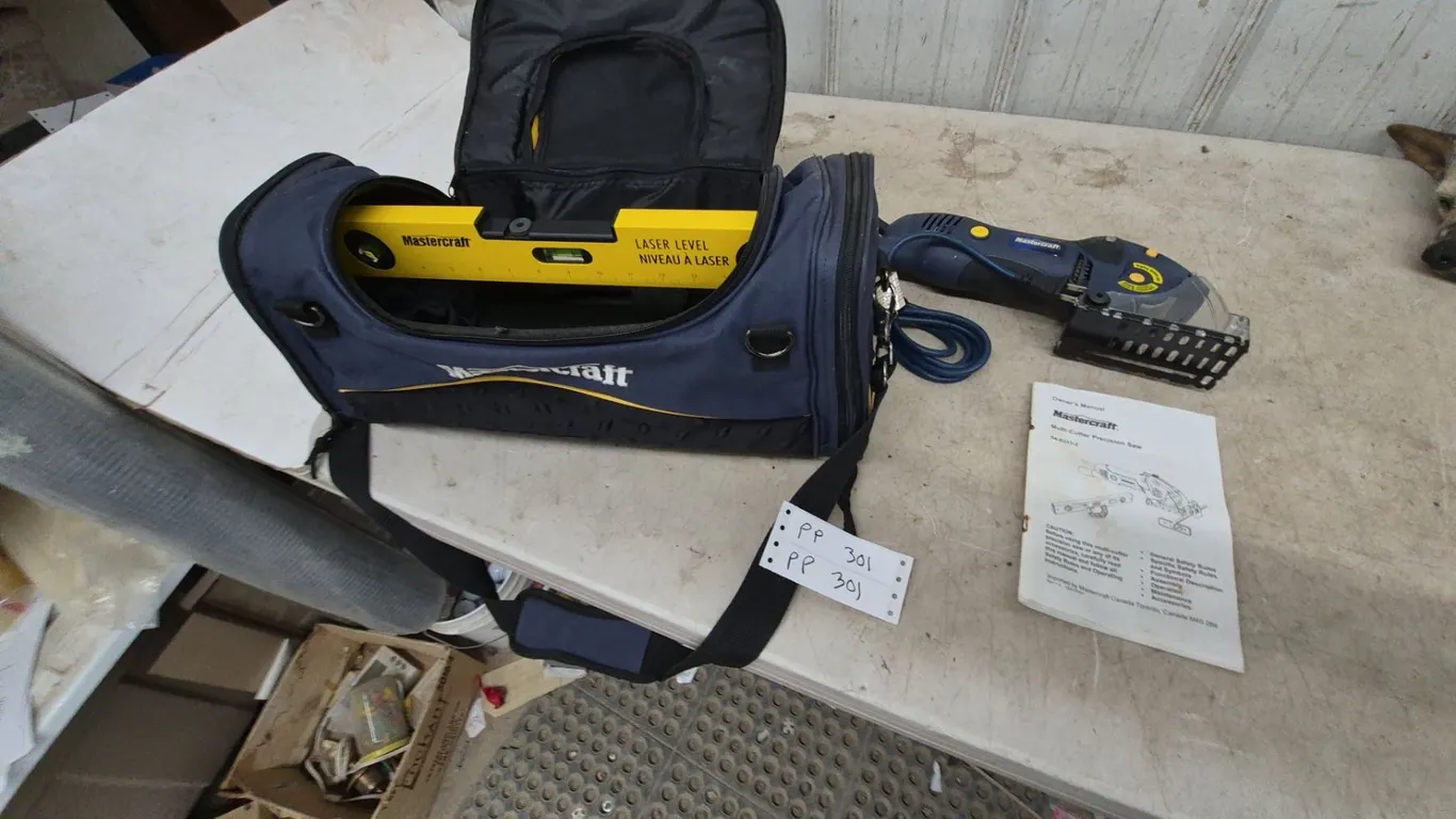 Mastercraft Laser Level and Multi-Cutter Precision Saw, Owner's Manual, and Carry Bag