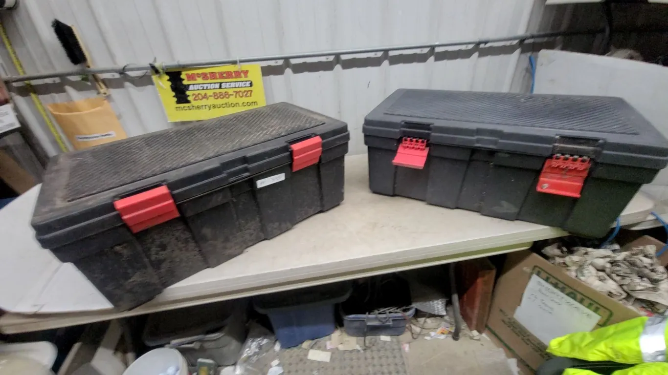 Two Black Plastic Storage Boxes with Red Latches 13”×32”×18”