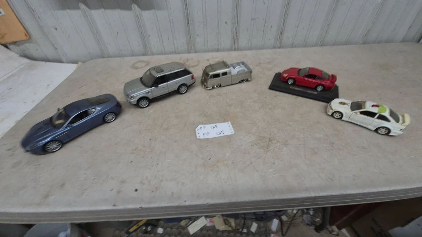 5 Die-Cast Model Cars: Aston Martin, Range Rover, and Porsche
