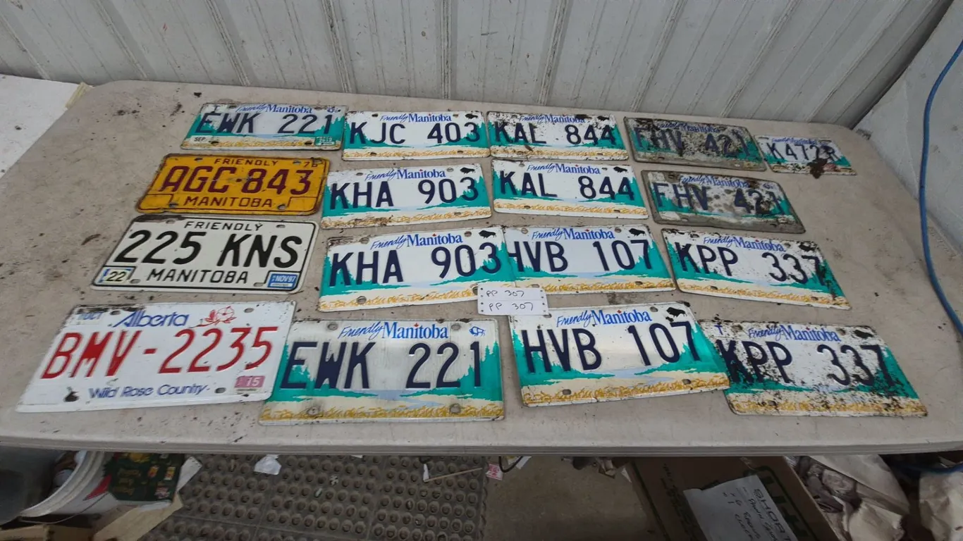 17 Manitoba and Alberta License Plates
