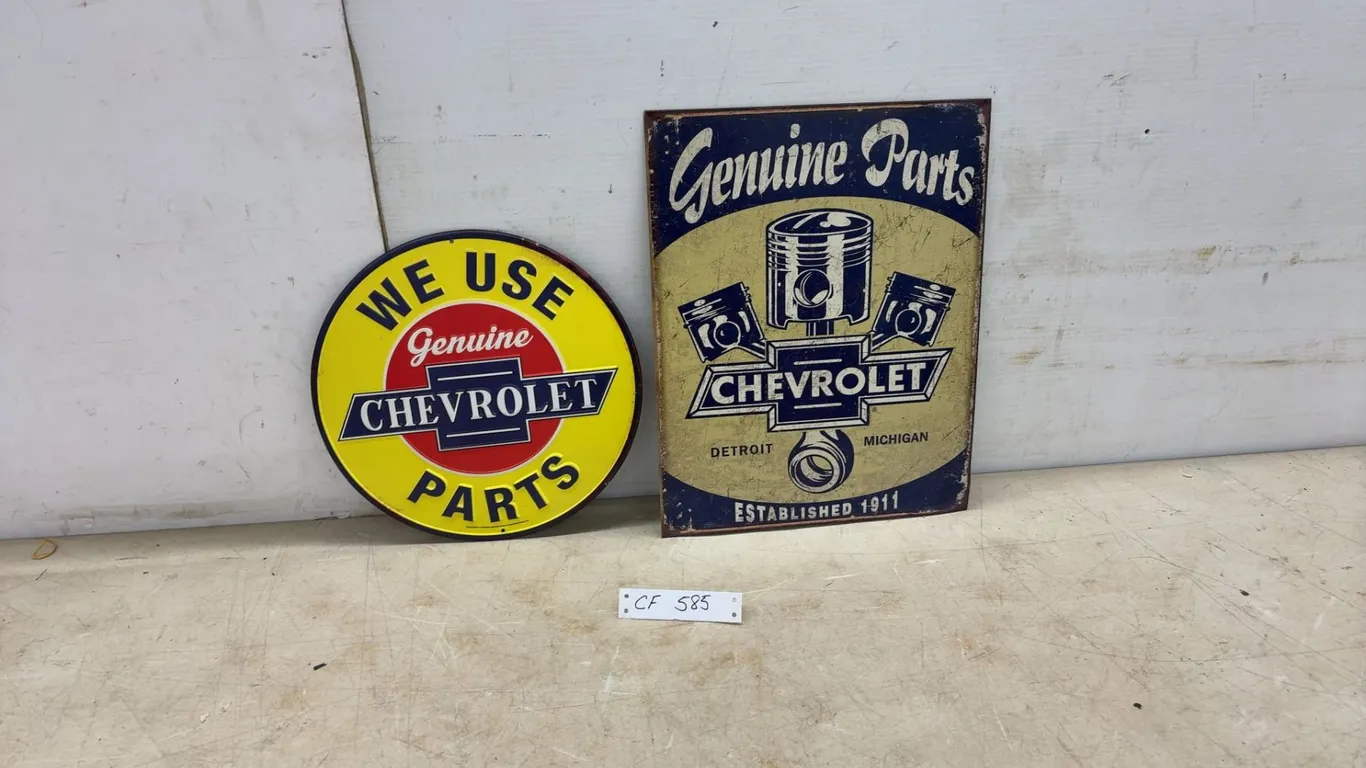 Two Modern Chev Genuine Parts Signs