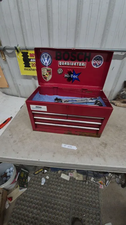 Red Metal Tool Box with Sockets, Ratchets, and Torque Wrench