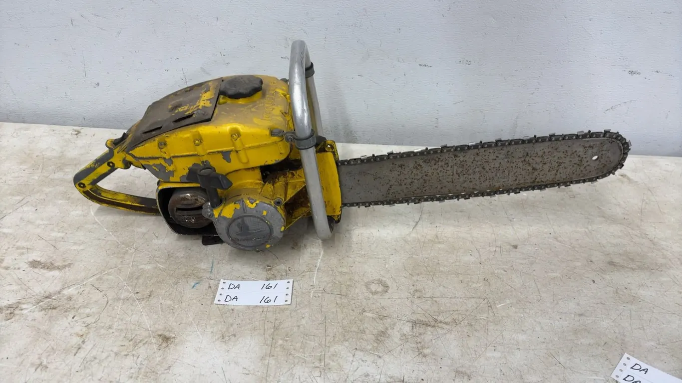Vintage Yellow McCulloch Chainsaw with Briggs and Stratton Engine, 16” Bar, and Handle
