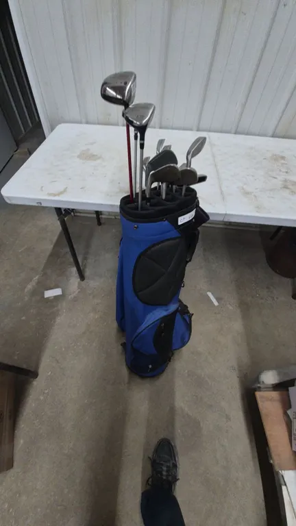 Callaway Big Bertha Titanium 454 10° Driver, Signature Series 19° 5 Wood, and Golden Bear Irons.