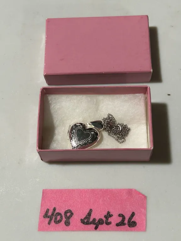 Silver coloured locket and 16” chain, no markings