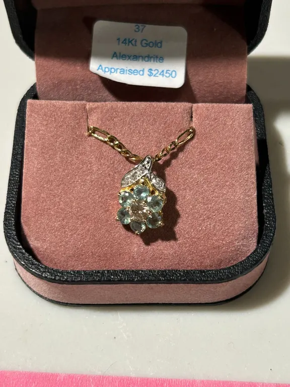 Alexandrite and diamond pendant with attractive 19” gold coloured chain, 2013 appraisal cer