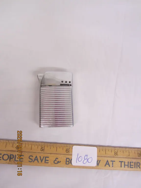 1080. Antique Bently Lighter
