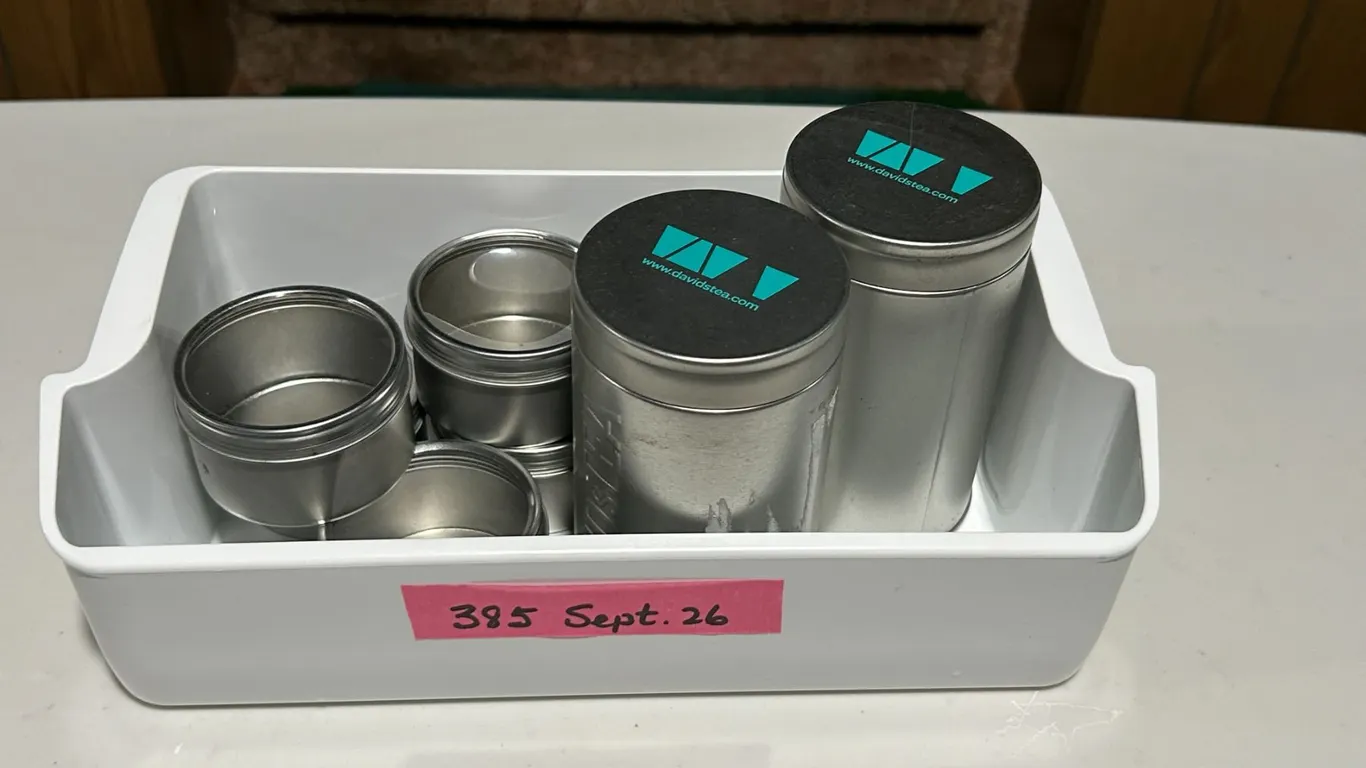 Tea/spice tins and plastic bin