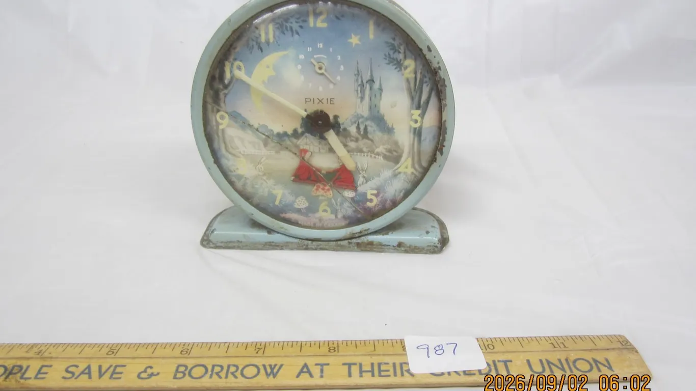 987. Antique Pixie Character Clock
