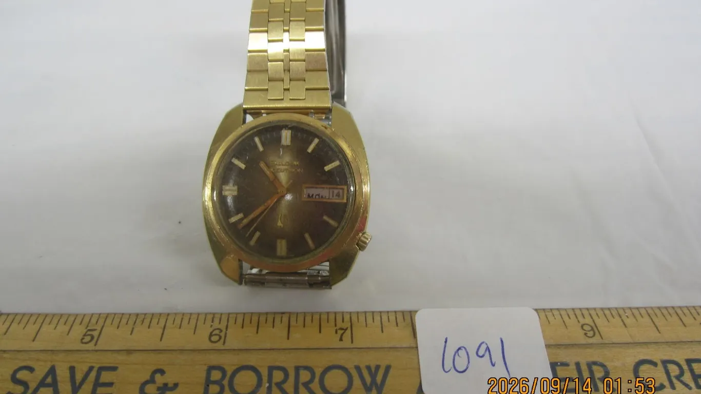 1091. Vintage Bulova Accutron Wristwatch in Gold with Day and Month