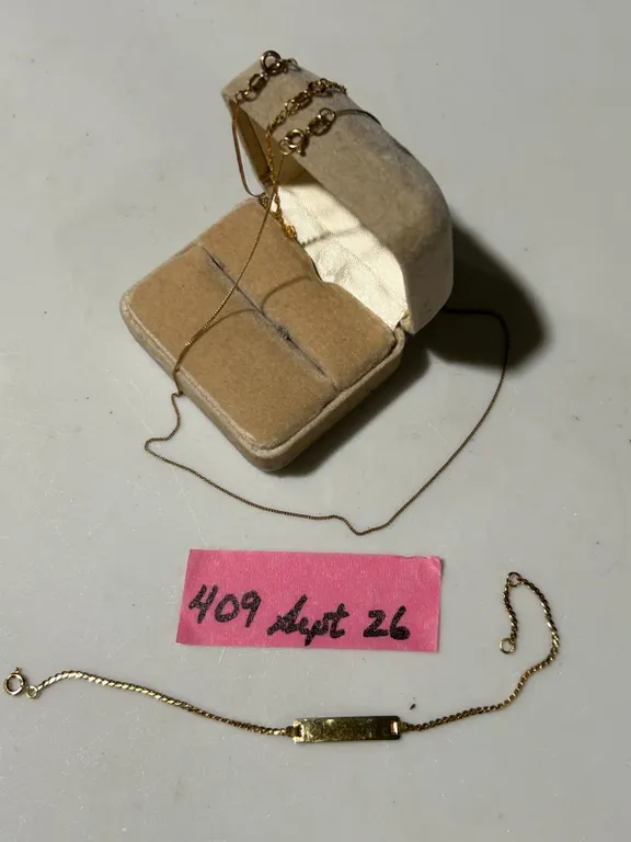 Gold bracelets and necklace, mostly 10K, 2.2 g (excluding the ID bracelet)