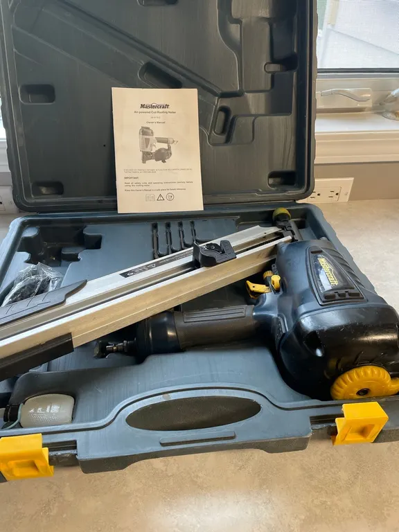 Air powered coil roofing nailer