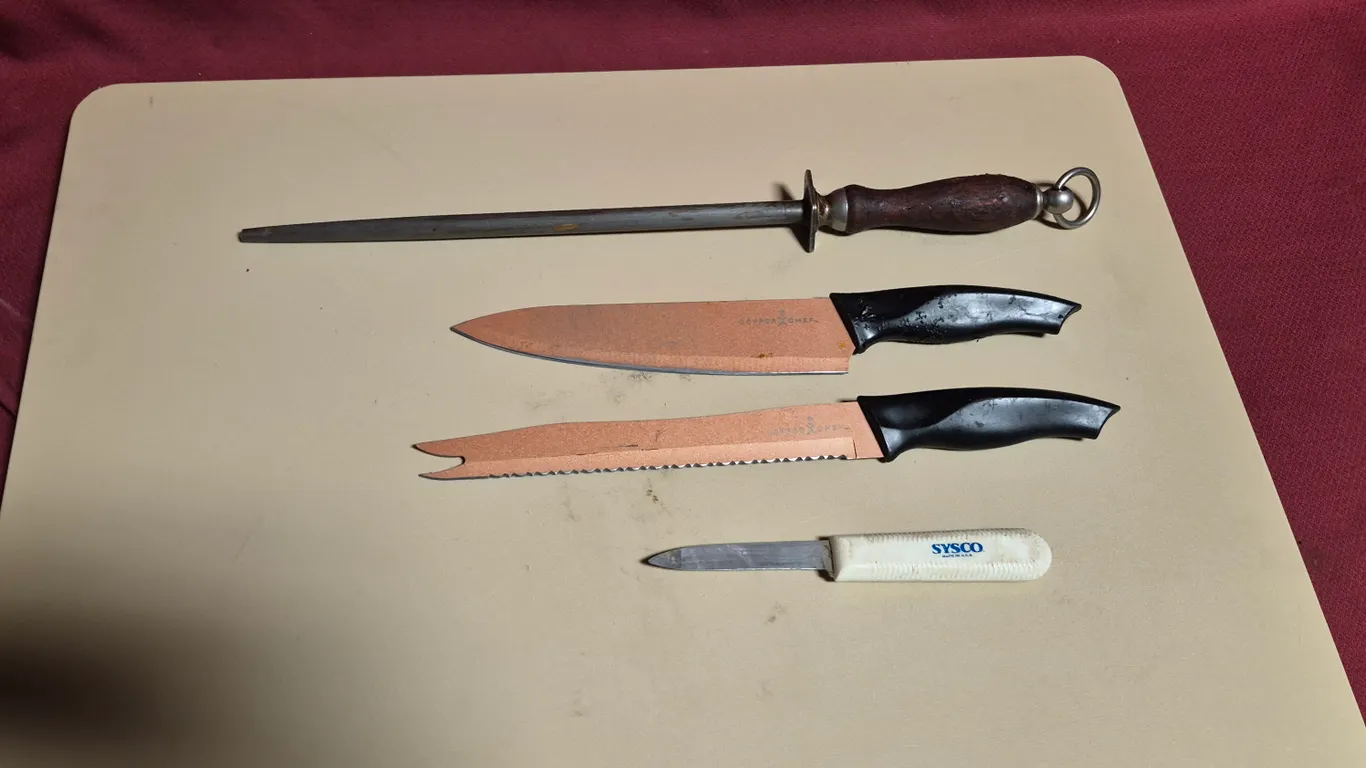 (3) Knives, (1) Sharpening Steel, (1) 18" x 26" Cutting Board