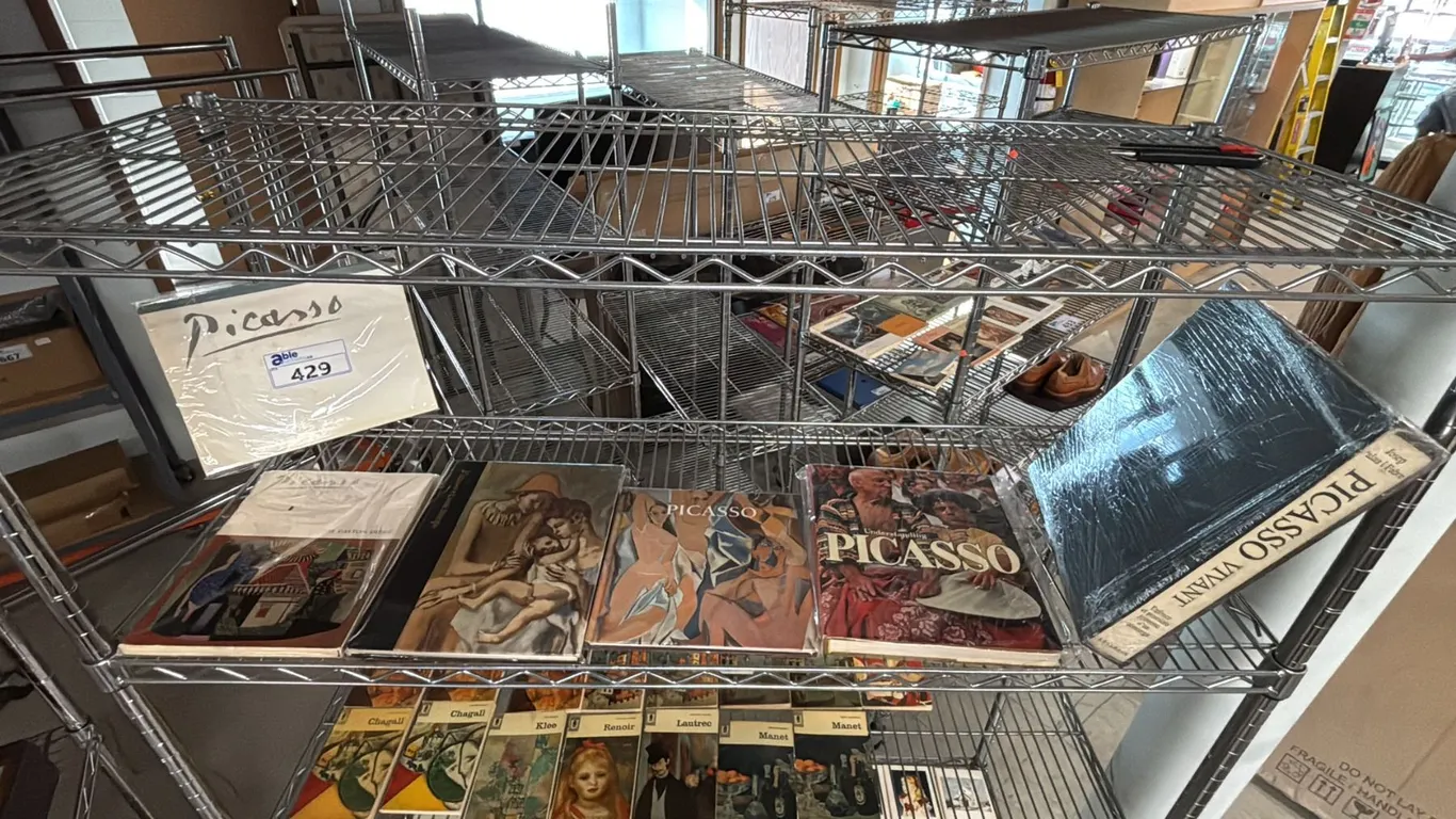 SHELF OF ASSORTED PABLO PICASSO BOOKS