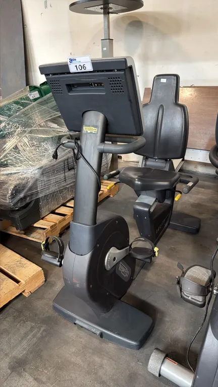TECHNOGYM EXCITE RECLINE COMMERCIAL STATIONARY BIKE WITH WIDE WALK THROUGH FRAME TRACK