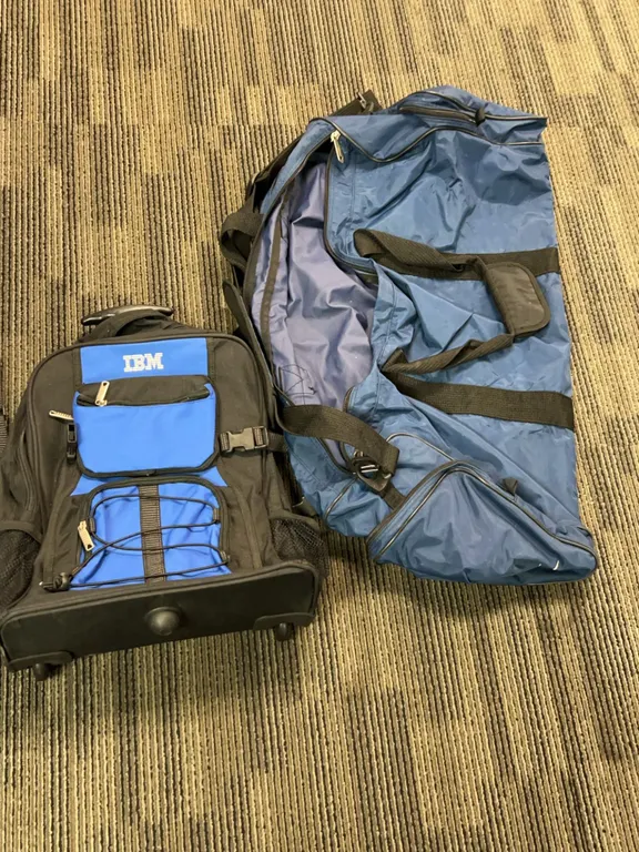 2 Bags: IBM Rolling Backpack and Large Nike Blue Sports Duffel Bag, Approx. 28 Inches Long, Used