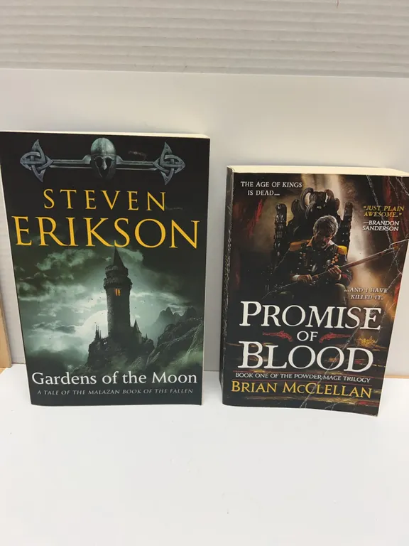 2 Modern Fantasy Paperbacks: "Gardens of the Moon" by Steven Erikson and "Promise of Blood" by Brian
