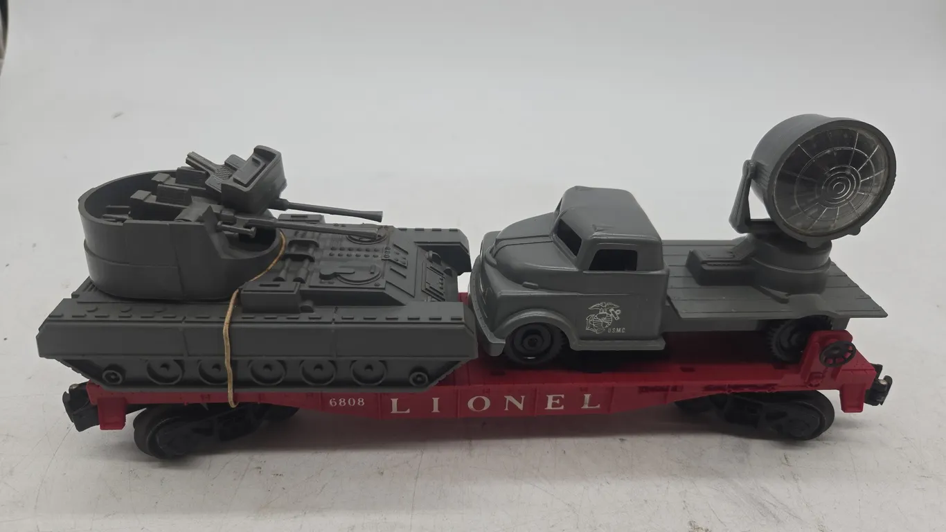 Vintage Lionel number 6808 US Marine corps flat car with tank and spotlight truck