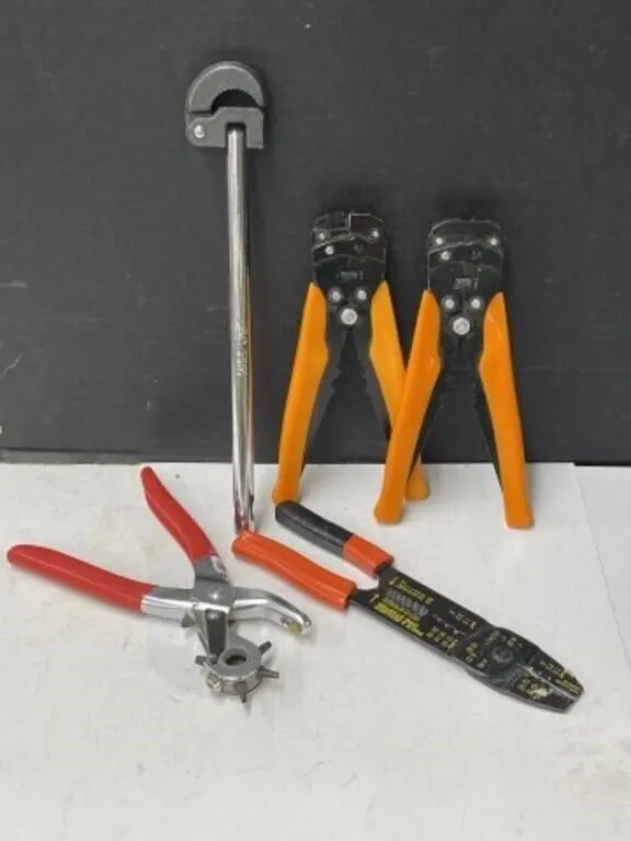 Wire Strippers And Revolving Hole Punch