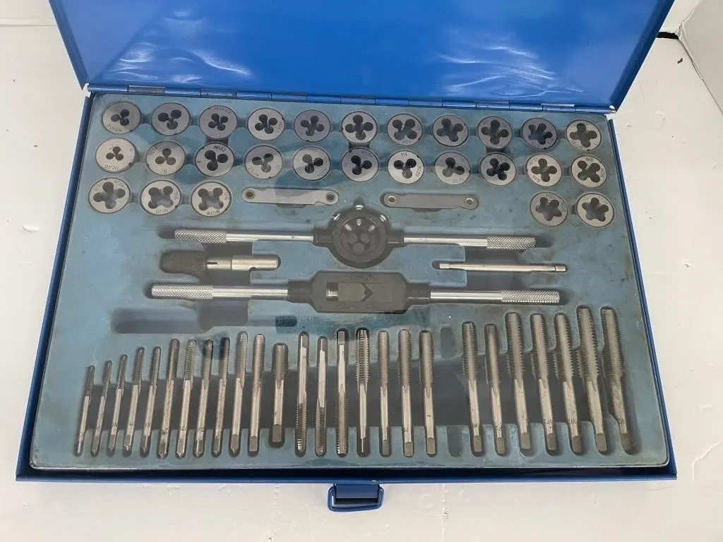 Incomplete tap and die set in a metal case.