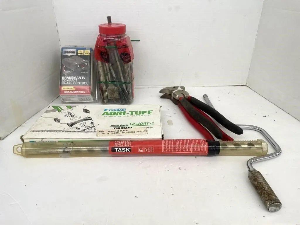 Two pairs of fencing pliers, a jar full of drill
