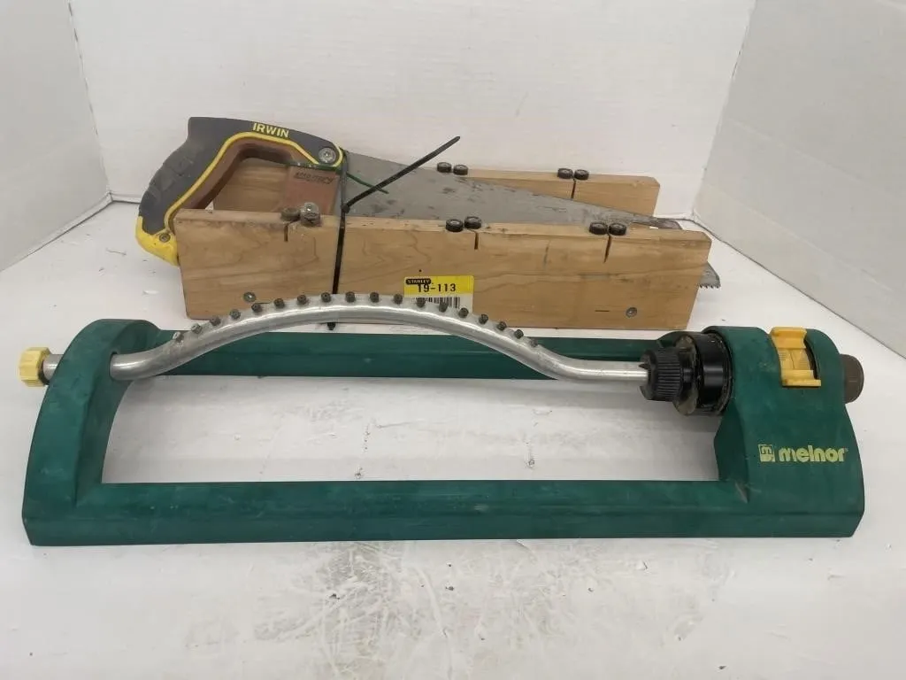 Miter box and saw with a lawn sprinkler.