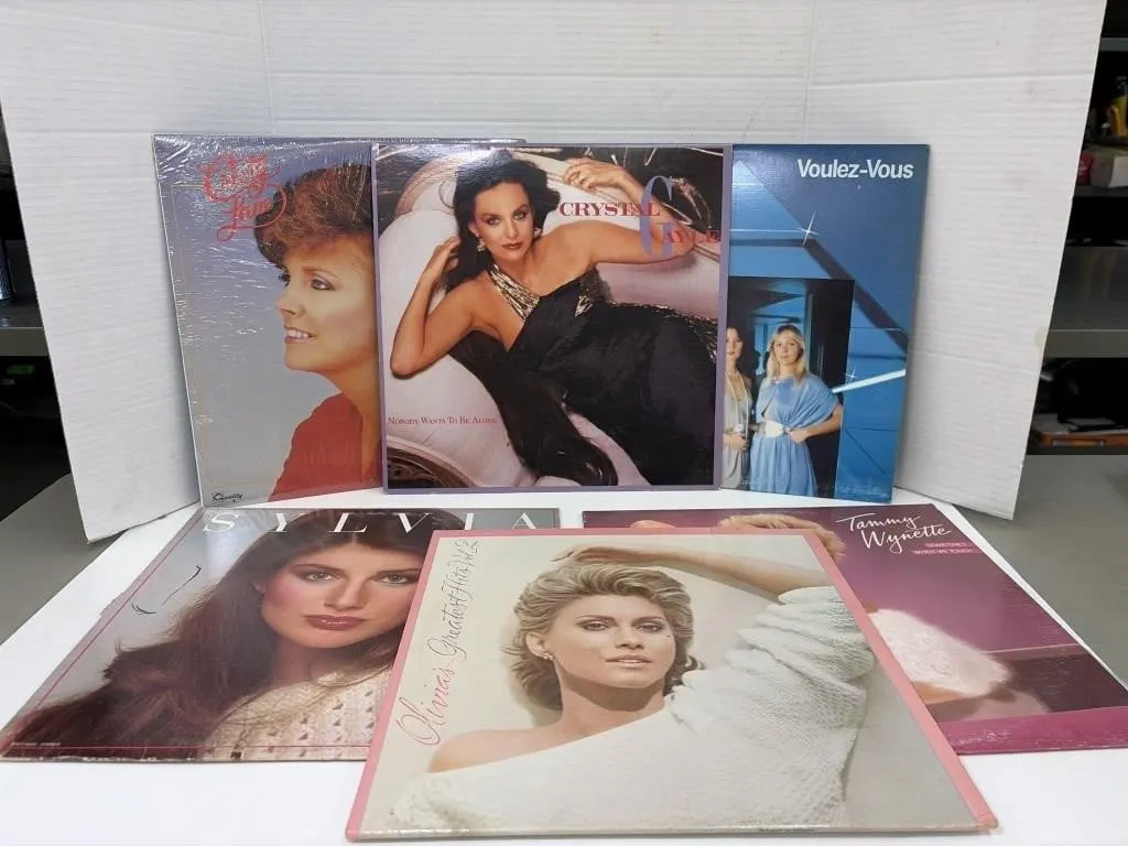 Vintage vinyl records featuring artists like