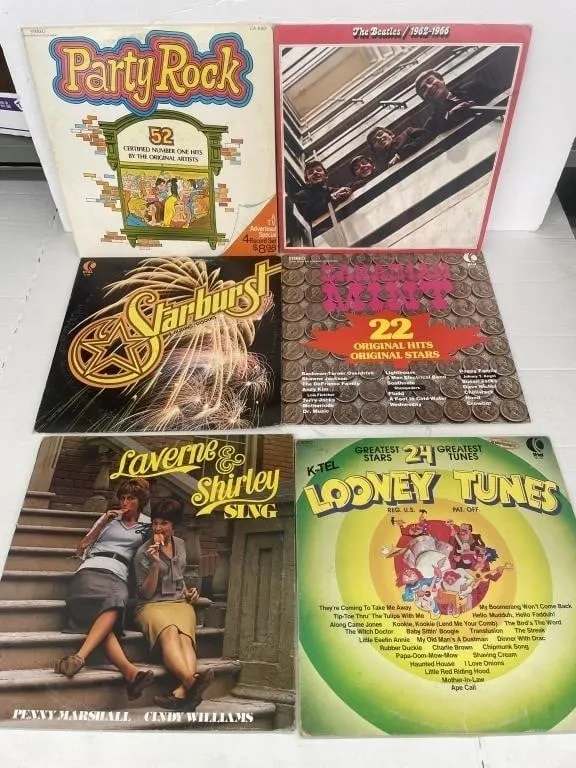 Eleven compilation or novelty pop LP records.
