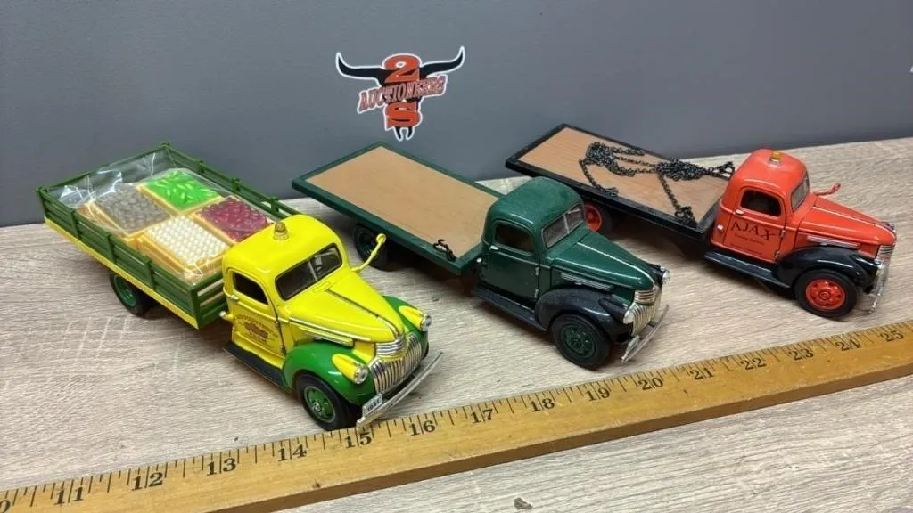 3 Toy Flatdeck Trucks. China.