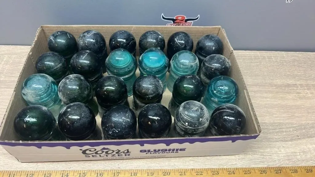 24 Green Glass Insulators. *NO SHIPPING