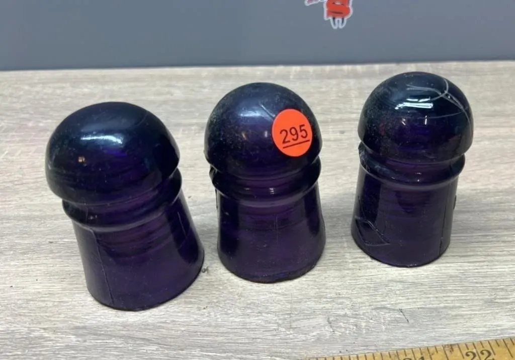3 Purple Glass Insulators.